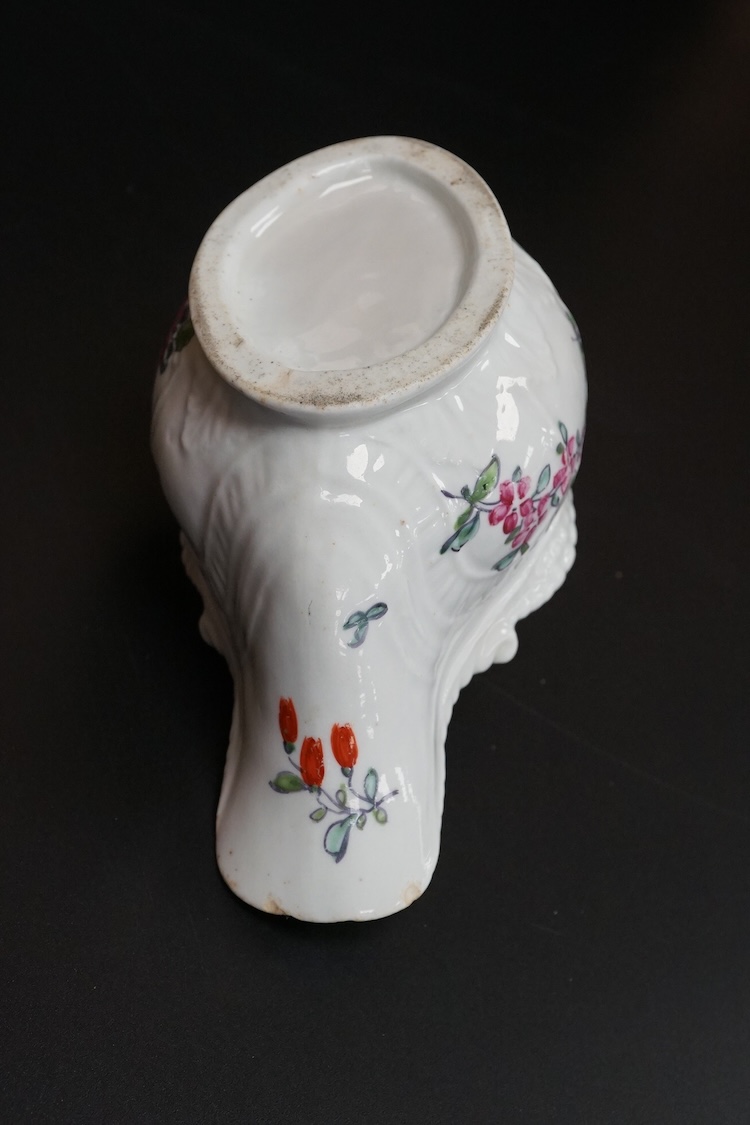 A Liverpool porcelain sauceboat, handpainted with flowers, circa 1760, 14cm wide